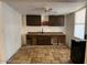 Unfinished kitchen highlighting tile floors, ample cabinet space, and new countertops at 3112 W Taylor St, Phoenix, AZ 85009