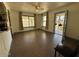 Open concept living room with tile floors, large windows and neutral paint at 3112 W Taylor St, Phoenix, AZ 85009