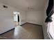 Spacious main bedroom featuring wood look floors, and an en suite bathroom at 3112 W Taylor St, Phoenix, AZ 85009