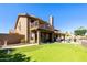 Expansive backyard with putting green, balcony, covered patio, and desert landscaping provides great outdoor space at 3538 E Squawbush Pl, Phoenix, AZ 85044