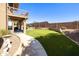 Expansive backyard featuring artificial turf and a private putting green at 3538 E Squawbush Pl, Phoenix, AZ 85044