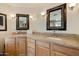 Double vanity with granite countertops, undermount sinks and updated fixtures offers a luxury experience at 3538 E Squawbush Pl, Phoenix, AZ 85044