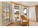 Bright bedroom featuring a reading chair and view of the backyard at 3538 E Squawbush Pl, Phoenix, AZ 85044