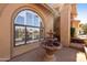 Exterior view featuring a water fountain, an arched window and a brick walkway at 3538 E Squawbush Pl, Phoenix, AZ 85044