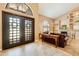 View of foyer and living area with a fireplace, neutral walls, and tile floors at 3538 E Squawbush Pl, Phoenix, AZ 85044