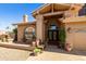 Inviting front entrance with decorative fountains, an arched window and a warm, welcoming feel at 3538 E Squawbush Pl, Phoenix, AZ 85044
