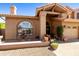 Inviting front entrance with a decorative fountain and warm curb appeal at 3538 E Squawbush Pl, Phoenix, AZ 85044