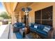 Comfortable patio area featuring plush couches, a heater, and stylish decor at 3538 E Squawbush Pl, Phoenix, AZ 85044