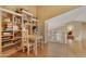 Open playroom with hardwood floors, built-in bookshelves, ' table, and plenty of natural light at 3538 E Squawbush Pl, Phoenix, AZ 85044