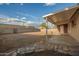 Spacious backyard with a covered patio and privacy fencing, ready for landscaping at 3632 W Mariposa St, Phoenix, AZ 85019