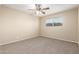 Bright bedroom featuring a ceiling fan, carpet, and a window at 3632 W Mariposa St, Phoenix, AZ 85019