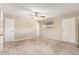 Spacious room featuring tile flooring, ceiling fan, and a neutral color palette at 3632 W Mariposa St, Phoenix, AZ 85019