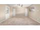 Spacious room featuring tile flooring, ceiling fan, and a neutral color palette at 3632 W Mariposa St, Phoenix, AZ 85019