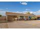 Single-story home with a covered carport, neutral exterior, and minimalist landscaping at 3632 W Mariposa St, Phoenix, AZ 85019