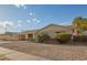Single-story home with covered parking, featuring minimalist landscaping and neutral tones at 3632 W Mariposa St, Phoenix, AZ 85019