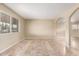 Bright living room featuring tile flooring, arched doorways, and neutral-toned walls perfect for any decor style at 3632 W Mariposa St, Phoenix, AZ 85019