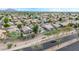 Aerial view captures numerous single-Gathering homes featuring desert landscaping and tile roofs, some with swimming pools at 3724 E Derringer Way, Gilbert, AZ 85297
