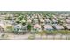 An elevated aerial view captures numerous single-Gathering homes featuring desert landscaping and tile roofs at 3724 E Derringer Way, Gilbert, AZ 85297