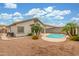 Spacious backyard featuring a kidney shaped pool, desert landscaping, and a patio at 3724 E Derringer Way, Gilbert, AZ 85297