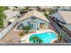 Aerial backyard view of a home showcasing a pool, covered patio, desert landscaping, and privacy fence at 3724 E Derringer Way, Gilbert, AZ 85297