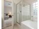Elegant bathroom with glass enclosed shower, soaking tub, and view of bedroom at 3724 E Derringer Way, Gilbert, AZ 85297