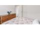 Comfortable bedroom with dresser and decor, featuring three closet doors at 3724 E Derringer Way, Gilbert, AZ 85297