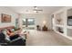 Bright living room with sliding glass doors that offer pool views and ample natural light at 3724 E Derringer Way, Gilbert, AZ 85297