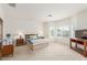 Spacious main bedroom with soft carpet, large windows, and ample natural light at 3724 E Derringer Way, Gilbert, AZ 85297