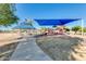 Community playground and picnic area with shade structure at 3724 E Derringer Way, Gilbert, AZ 85297