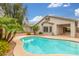 Backyard pool with an adjacent covered patio area, perfect for outdoor relaxation at 3724 E Derringer Way, Gilbert, AZ 85297