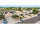 An elevated shot features three single-Gathering homes with desert landscaping, driveways, and tile roofs, two equipped with solar panels at 3724 E Derringer Way, Gilbert, AZ 85297