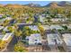 Sprawling aerial view showcases a peaceful neighborhood with mountains in the background at 39 E Tam Oshanter Dr, Phoenix, AZ 85022