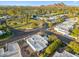 Scenic aerial view features mature trees, neighborhood park, and houses with a stunning mountain backdrop at 39 E Tam Oshanter Dr, Phoenix, AZ 85022