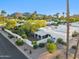 An aerial view shows the home with a fenced backyard in a neighborhood with desert landscaping and palm trees at 39 E Tam Oshanter Dr, Phoenix, AZ 85022
