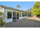 Backyard featuring sliding glass doors to the house and a gravel-covered area at 39 E Tam Oshanter Dr, Phoenix, AZ 85022
