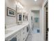 Bright bathroom features double sinks, white countertops, and tiled floors at 39 E Tam Oshanter Dr, Phoenix, AZ 85022