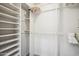 Walk-in closet with shelving and multiple hanging rods for ample storage space at 39 E Tam Oshanter Dr, Phoenix, AZ 85022