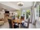 Well-lit dining room with backyard views, access to the living room, and modern decor at 39 E Tam Oshanter Dr, Phoenix, AZ 85022
