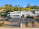 Beautiful single-story home with a well-manicured front yard and attached two-car garage at 39 E Tam Oshanter Dr, Phoenix, AZ 85022