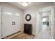 Elegant foyer featuring a double front door, hardwood floors, and decorative accent pieces at 39 E Tam Oshanter Dr, Phoenix, AZ 85022