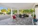 Covered patio with ample seating area and view of the well-maintained backyard at 39 E Tam Oshanter Dr, Phoenix, AZ 85022