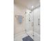 Bright bathroom featuring marble tile shower with glass door and mosaic tile floor at 39 E Tam Oshanter Dr, Phoenix, AZ 85022