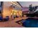 Home backyard features a pool, patio, and view of the second story balcony at 4038 E Wagon Cir, Gilbert, AZ 85297