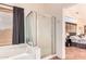 This is a shower in the bathroom with tile floors and a bedroom right next to it at 4038 E Wagon Cir, Gilbert, AZ 85297
