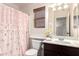 Charming bathroom featuring a single sink and a toilet with a pink bow shower curtain at 4038 E Wagon Cir, Gilbert, AZ 85297
