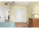 Bedroom featuring a closet with sliding doors, a lamp, and a dresser at 4038 E Wagon Cir, Gilbert, AZ 85297