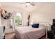Cozy bedroom featuring a full size bed and a window overlooking the neighborhood at 4038 E Wagon Cir, Gilbert, AZ 85297
