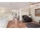 Relaxing bonus room features a recliner, ceiling fan, and natural light at 4038 E Wagon Cir, Gilbert, AZ 85297