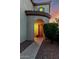 Inviting entryway with an arched doorway, neutral paint, and well-maintained landscaping at 4038 E Wagon Cir, Gilbert, AZ 85297