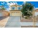 Inviting two-story home featuring a two-car garage, desert landscaping, and a well-maintained front yard at 4038 E Wagon Cir, Gilbert, AZ 85297